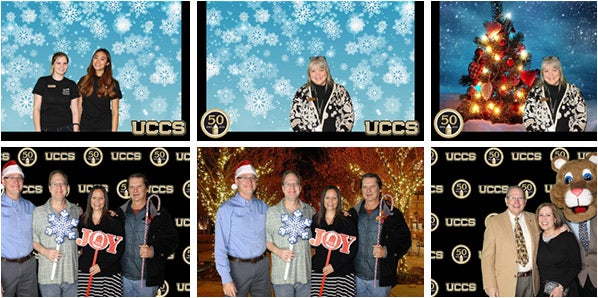 People celebrating UCCS' 50th anniversary at a photo booth
