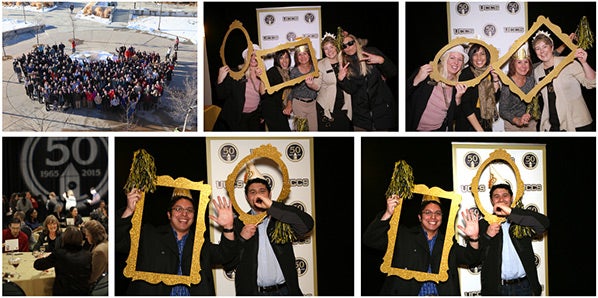 People celebrating UCCS' 50th anniversary at a photo booth