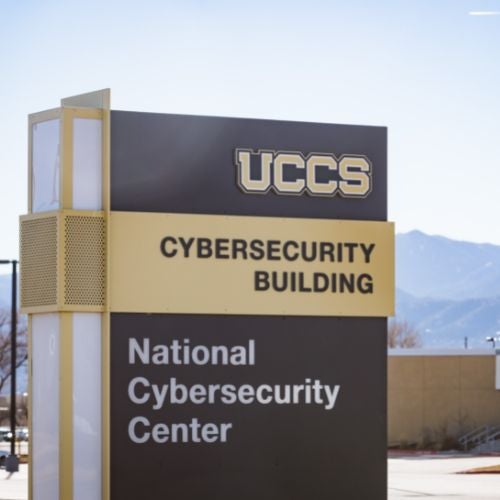 photo of the uccs cybersecurity building withe the mountains in the background