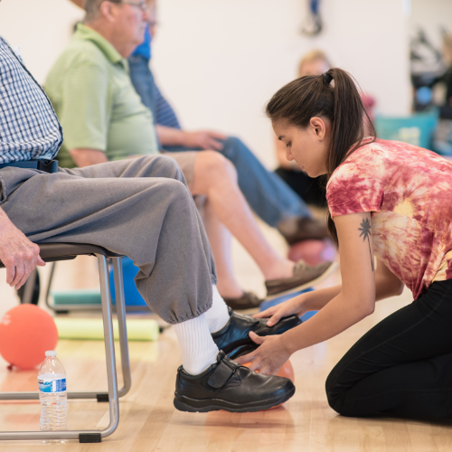 Health science student performing physical therapy