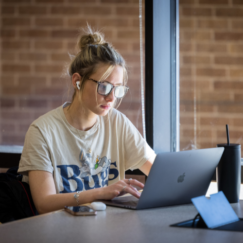 student studying on campus