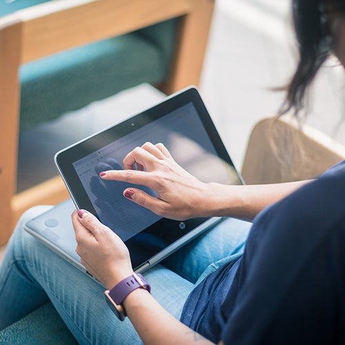 a student clicks on a tablet