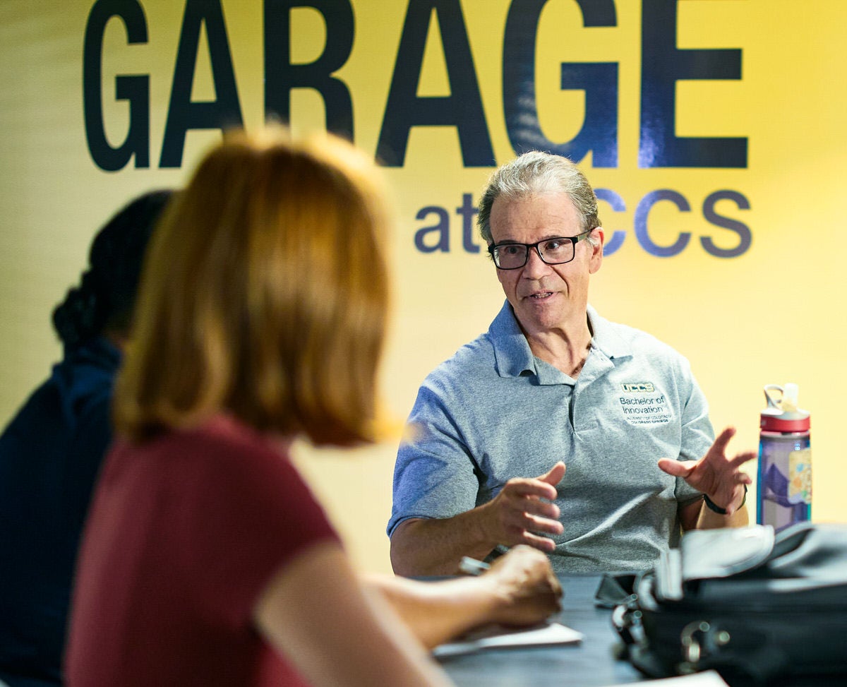 A professor teaching UCCS students