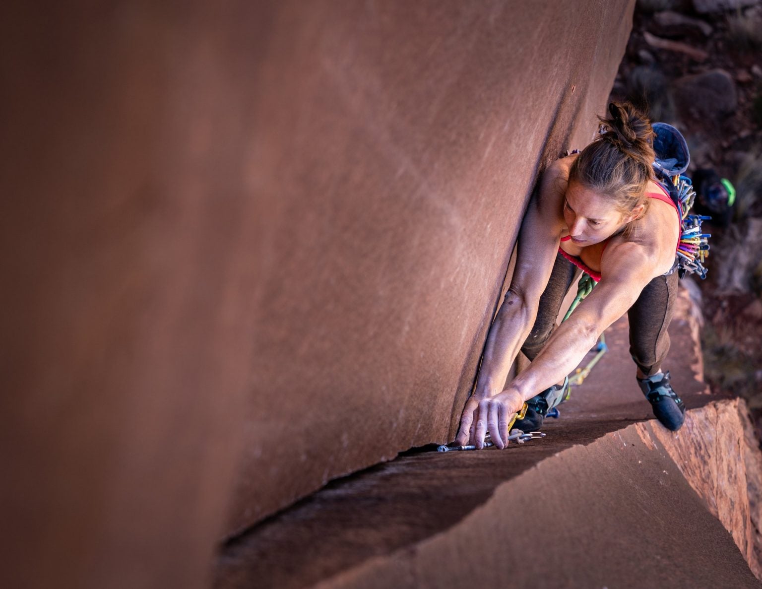 Amity Warme rock climbing. Photo credit: Felipe Tapia Nordenflycht